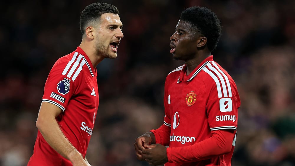 Diogo Dalot (2) of Manchester United interacts with Carlos Baleba (20) of Manchester United during the Premier League match between Manchester United and Tottenham Hotspur at Old Trafford, Manchester, UK on 10 October 2026.